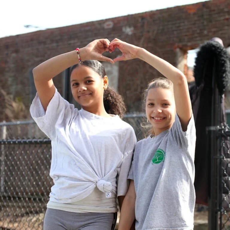 students forming a heart shape